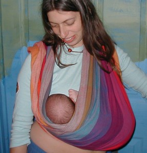 DiagonalCradleCarry Cradle carry with baby's head toward the outer rail of the wrap fabric.