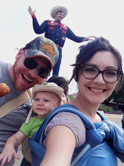 Babywearing in front of Big Tex statue in Dallas.